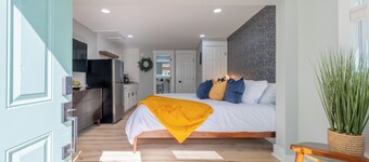 Charming entry and spacious back deck surrounded by nature, perfect for a peaceful getaway.