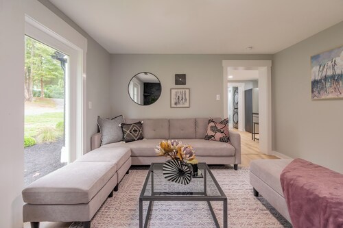 Charming entry and spacious back deck surrounded by nature, perfect for a peaceful getaway.