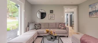 Charming entry and spacious back deck surrounded by nature, perfect for a peaceful getaway.