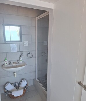 Shower, towels, soap, toilet paper