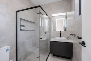 Shower, hair dryer, towels, soap