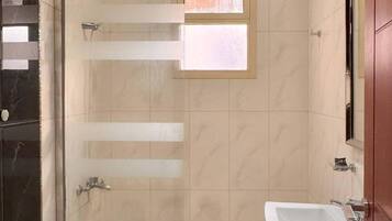 Separate bathtub and shower, free toiletries, towels, soap