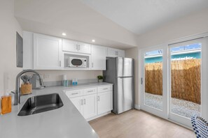 Private kitchen - Steps to Beach | King Bed | Parking | Pet-Friendly (Cocoa Beach)