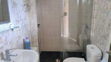 Shower, hair dryer, towels, soap