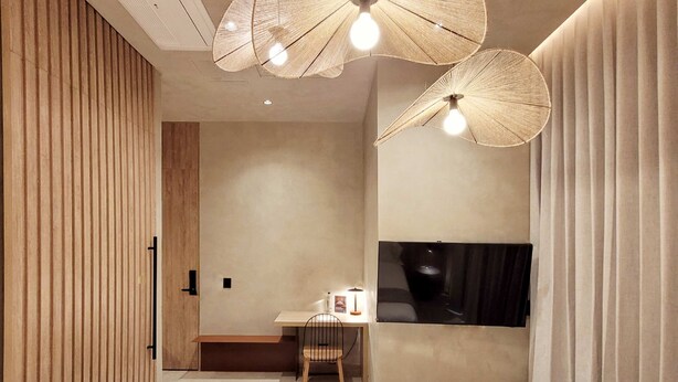 A modern bedroom with a bed, a desk, and a TV. - w Sophisticated 1BR w Terrace in El Poblado (Medellín)