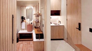A modern bathroom with a wooden vanity, a large mirror, and a hanging towel rack. - w Sophisticated 1BR w Terrace in El Poblado (Medellín)