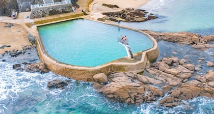 Typical Breton house with garden near the sea and the Bay of Saint Brieuc