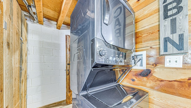 A compact kitchen with a built-in oven and a wooden wall with a 'BIN' sign. - < 1 Mi to Grindstone Lake: Cabin w/ Large Yard! (Ruidoso)
