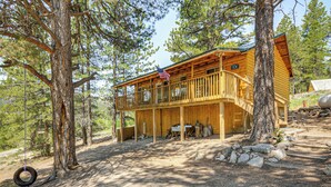 A wooden cabin with a balcony, surrounded by trees. - Furnished Deck & Mountain Views: Panguitch Cabin (Panguitch)