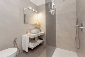 Comfort Room, Pool View | Bathroom | Shower, hair dryer, towels, soap