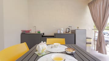Comfort Room, Pool View | Private kitchen | Full-size fridge, stovetop, cookware/dishes/utensils