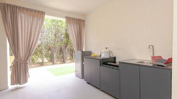 Comfort Triple Room, Courtyard View | Private kitchen | Full-size fridge, stovetop, cookware/dishes/utensils