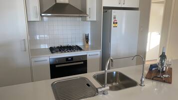 Family House | Private kitchen | Full-size fridge, microwave, oven, stovetop