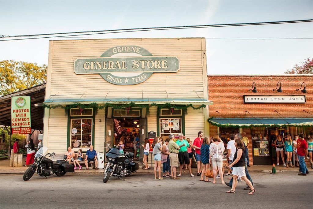 A storefront with a sign reading "Gruene General Store" and "Cotton Eyed Joe's" in Gruene, Texas.