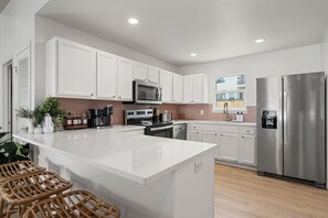Coffee/tea maker, fridge, microwave, oven