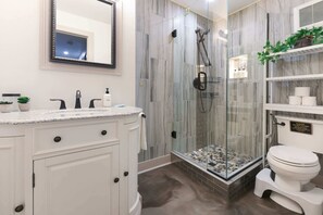 Shower, hair dryer, towels, shampoo