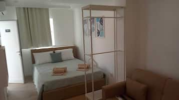 Triple Room, Courtyard View | Blackout drapes, iron/ironing board, free WiFi