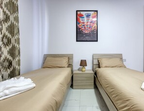 2 bedrooms, desk, iron/ironing board, travel cot