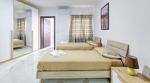 4 bedrooms, desk, iron/ironing board, travel cot