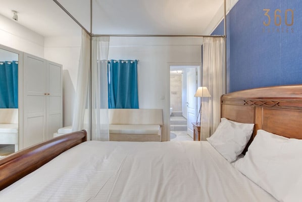 1 bedroom, desk, iron/ironing board, travel crib