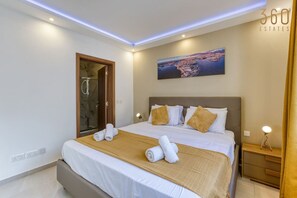 1 bedroom, desk, iron/ironing board, travel cot