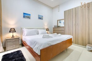 1 bedroom, desk, iron/ironing board, travel cot