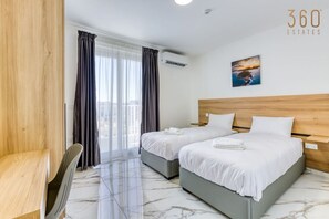 2 bedrooms, desk, iron/ironing board, travel crib