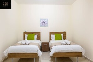 2 bedrooms, desk, iron/ironing board, travel crib