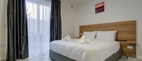 1 bedroom, desk, iron/ironing board, travel crib