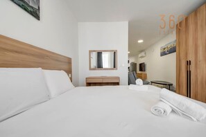 1 bedroom, desk, iron/ironing board, travel cot