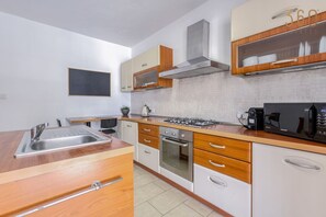 Fridge, microwave, oven, stovetop - Modern 2BR home with private balcony in Swieqi (Is-Swieqi)