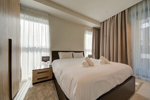 1 bedroom, desk, iron/ironing board, travel crib