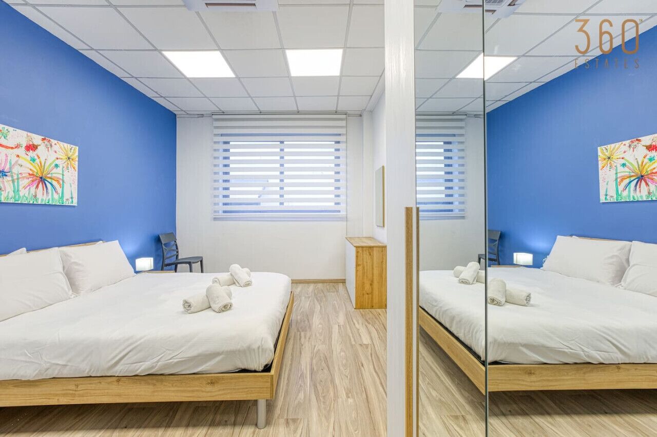 1 bedroom, desk, iron/ironing board, travel crib