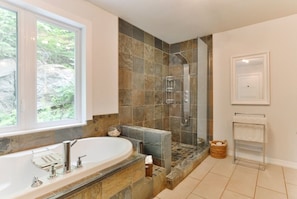 Shower, hair dryer, towels, toilet paper