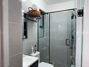Shower, hair dryer, towels, soap