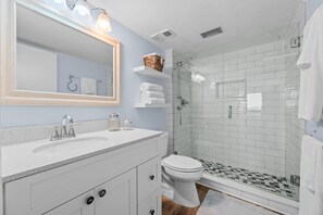 Shower, hair dryer, towels, soap