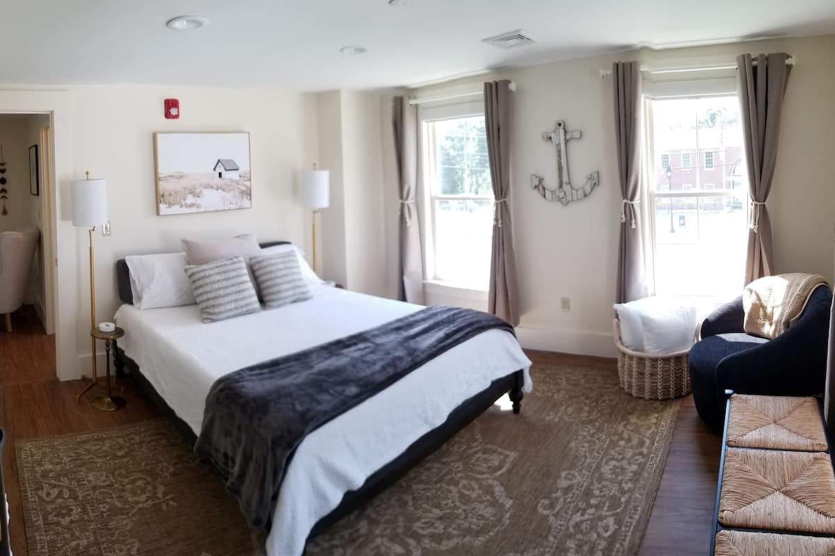Suite, 1 Queen Bed | Iron/ironing board, free WiFi, bed sheets