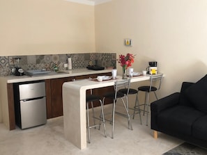 Family Triple Room | Private kitchen | Fridge