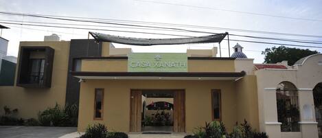 A building with a sign reading "CASA XANATH SERENE HOUSING".