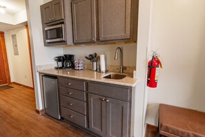 Microwave, stovetop, coffee/tea maker, dining tables