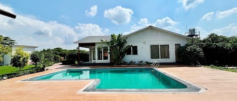 Outdoor pool, open 3:00 PM to midnight, pool umbrellas