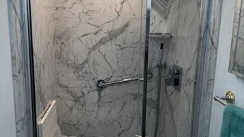Shower, hair dryer, towels, soap