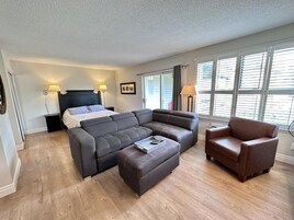 Standard Apartment, 1 Queen Bed with Sofa bed, Balcony, Mountain View | Living area | Flat-screen TV