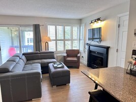 Standard Apartment, 1 Queen Bed with Sofa bed, Balcony, Mountain View | Living area | Flat-screen TV