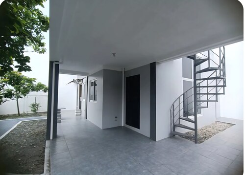  3-bedroom house with a garden, located in a safe, guarded village, with AC.