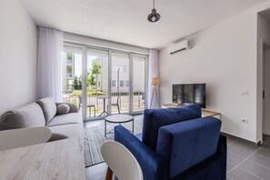 TV - Talea Holiday Apartments | 1 by PikHost (Tale)