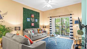 Condo, Multiple Beds, Balcony, Garden View (Mickey’s Postcard at Bahama Bay) | Living area | 42-inch flat-screen TV with digital channels