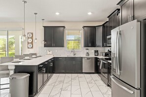 House, Multiple Beds, Private Pool, Pool View (Resort Vibes At Championsgate) | Private kitchen | Fridge, microwave, oven, stovetop