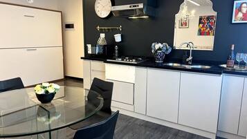 Fridge, microwave, stovetop, coffee/tea maker