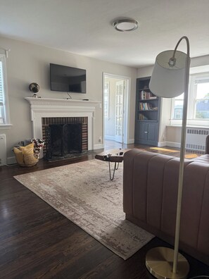 Smart TV, fireplace, books